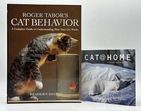 Front covers of both hardcover cat books