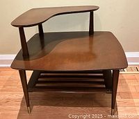 Front angled view showing two tiers, legs and lower shelf