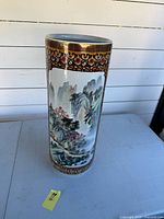 Full view of tall cylindrical vase