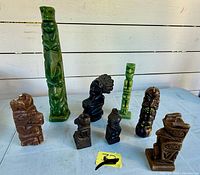 Group shot of all eight wax totem candles upright