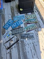 All licence plates and frame laid on floor