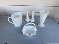 Group shot of all milk glass pieces on table