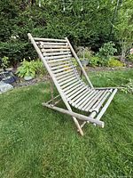 Front angled view of bamboo recliner chair showing slatted seat/back