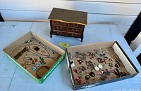 Overview of chest and two boxes of jewellery