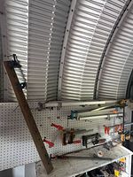 Overall view of pegboard with assorted clamps