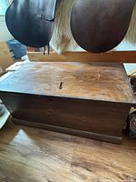 Overall view of wooden blanket chest front and top