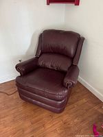 Full front view of burgundy leather armchair