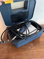 Open case showing rotary tool, flex-shaft, manual