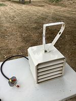 Oblique view of StelPro heater showing power cord and bracket