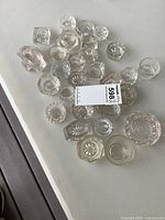 Top view showing entire assortment of glass salt dishes laid out on table