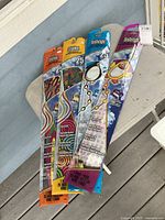 Four sealed kite packages laid out, showing full fronts