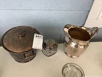 Group shot of ice bucket, condiment jar, pitcher, ashtray