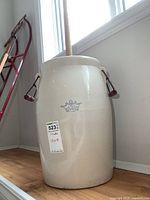 Full view of stoneware churn with dasher inserted