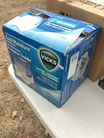 Retail box front and side panels showing Vicks branding and product information