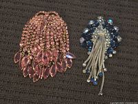 Both brooches side by side