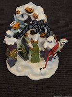 Full view of snow-covered Nightmare Before Christmas display