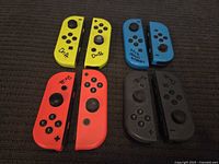 Four pairs of Joy-Cons yellow red blue gray