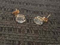 Front view showing stones and gold prongs