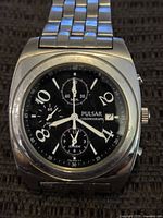Front view of Pulsar chronograph watch showing dial and bracelet