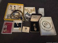 Group shot of all jewelry pieces in boxes and loose