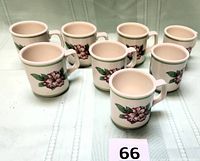 All eight Rhododendron Resort mugs front view