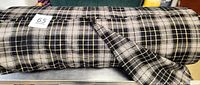 Full view of fabric bolt showing plaid pattern and width