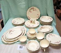 Full 51-piece Virginia Rose china set displayed