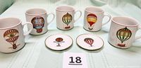 Front view of 5 mugs and 2 coasters showing balloon graphics