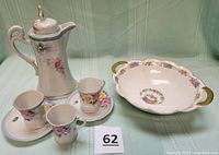 Group shot showing pitcher with lid, three cups, two saucers and Haviland bowl