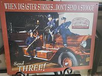 Front view of tin sign showing overall artwork and text