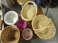 Top view of six assorted baskets on table