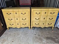 Front view showing both matching yellow dressers side by side