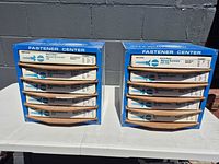 Two blue Fastener Center cabinets side by side on table