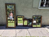 All five mirrors lined up showing relative sizes and frame styles