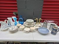 Group shot of all dinnerware, glass, metal and ceramic items