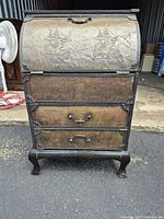 Full view of cabinet showing drop-front top and two drawers on cabriole legs