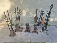 Group shot of all fireplace accessories lined along wall