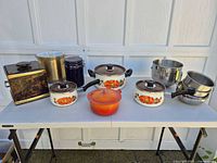 Group shot of all cookware, bowls and ice buckets on table