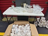 Entire lot on table and wrapped items in box