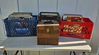 Overview showing blue crate of LPs, brown carrying case of 78s, red crate of LPs