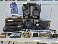 Group shot of all electronics including speakers, Sony CD changer, Rotel amp, antenna box