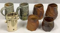 All seven pottery pieces grouped