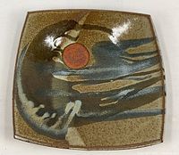 Top view of square pottery platter showing full glaze pattern