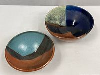 Both stoneware bowls top view showing glaze patterns