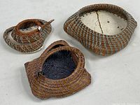 Group view of three mixed-media baskets