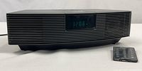 Front view of Bose Wave Radio showing display and remote