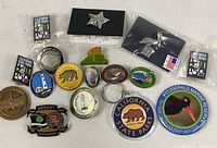 All items laid out showing variety of pins and keychain