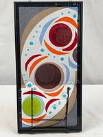 Full view of framed glass art panel