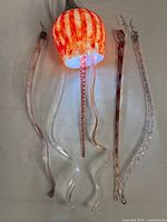 Overall view of glass jellyfish light with detached tendrils