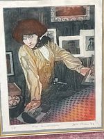 Close-up of the etching showing figure, hand coloring, artist signature and edition